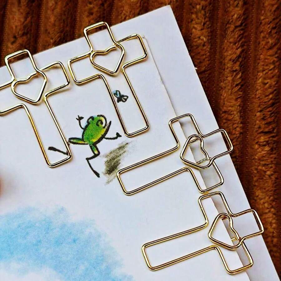 15/25pcs Heart Cross Shaped Paper Clips, Hollow Heart Cross Line Solid Color Metal Design, Cross Hollow Paper Clip Shape, Room Decor, Office Desk Accessories - Gold - View 1