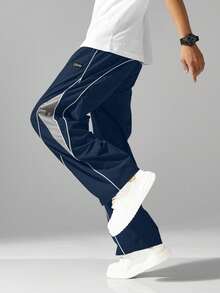 Pantalones deándal holgados estilo calle para hombre, cintura con cordón, pantalones casuales de color contrastante, adecuados para uso casual, ribete de borde unido, cintura elástica cómoda con cordón, estilo deportivo, pantalones de pierna recta holgada y ancha de moda casual de color contrastante. - Azul marino - Ver 2
