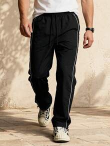 Pantalones deportivos casuales de verano para hombres con cintura elástica y cordón, diseño unisex, adecuados para primavera y otoño, con rayas y contraste de color - Negro - Ver 1
