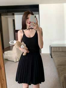 RUIWY Women's Elegant Black Knit Mini Dress For Summer And Autumn, Spaghetti Strap Design, Pleated Hem And Flared Skirt, Perfect For Evening Wear - Black - View 1
