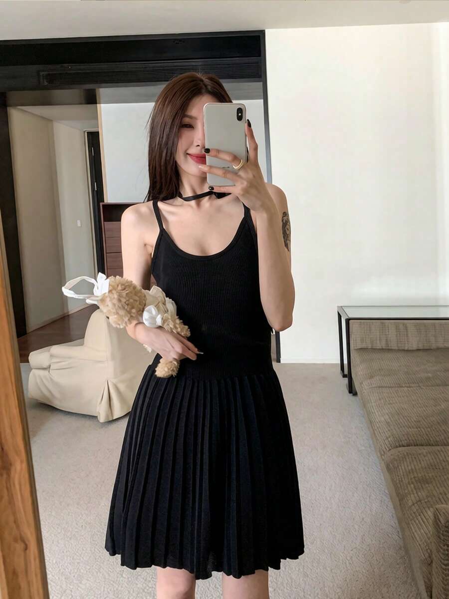 RUIWY Women's Elegant Black Knit Mini Dress For Summer And Autumn, Spaghetti Strap Design, Pleated Hem And Flared Skirt, Perfect For Evening Wear - Black - View 1