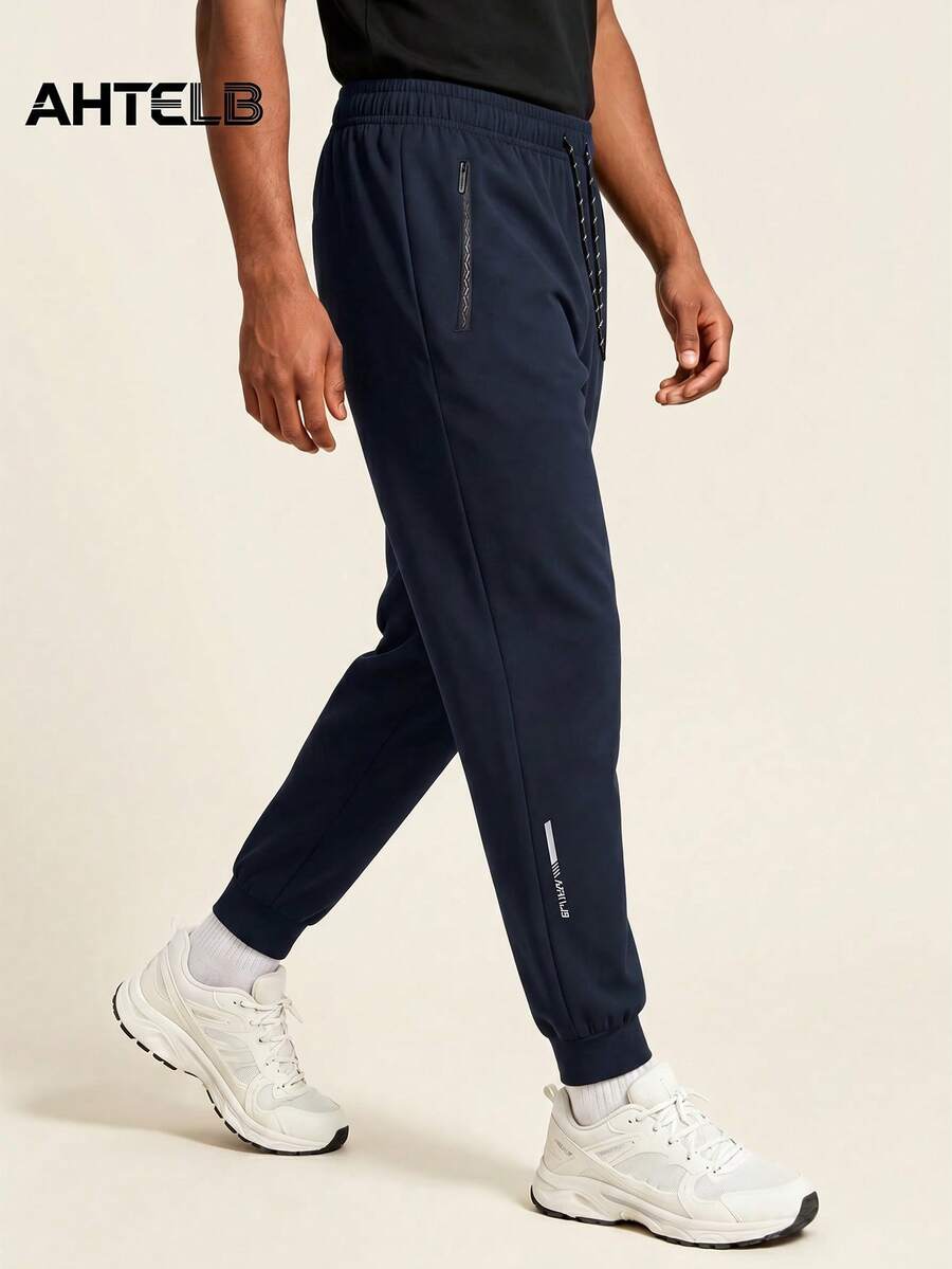 AHTELB Summer Men's Side Letter Print Sports Casual Pants, Minimalist Solid Color Fashion Elastic Drawstring Versatile Joggers, Anti-Theft Zipper Design, Suitable For Outdoor Leisure, Entertainment And Running Sports, Pants For Men, Gym Clothes Men, Sweatpants For Men, For Friends, Husband, Boyfriend Gifts - Navy Blue - View 1