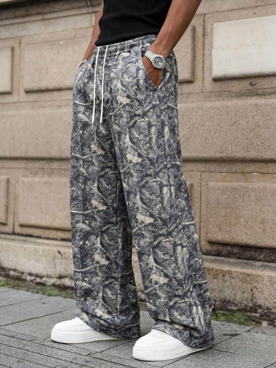 MAISONFOX Men's Fashion Street Elastic Waist Leaf Print All-Over Camouflage Print Sports Pants, Men's Fashion Pants Leaf Print, Loose Flare Leg Design - Army Green - View 1
