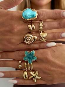 Set de 10 anillos con diseño de tema oceánico en tono dorado, diseñados para mujeres, con gruesas anillos de estrella de mar y conchas de color azul-verde, con estilo bohemio y de playa de moda - Dorado - Ver 1