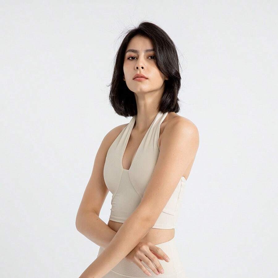 Sutiã esportivo feminino sem costas com decote em V, top cropped acolchoado canelado sem costura, top regata sexy com decote em V para mulheres, adequado para ioga, academia e fitness. - Cor de damasco ao leite - Visão 1