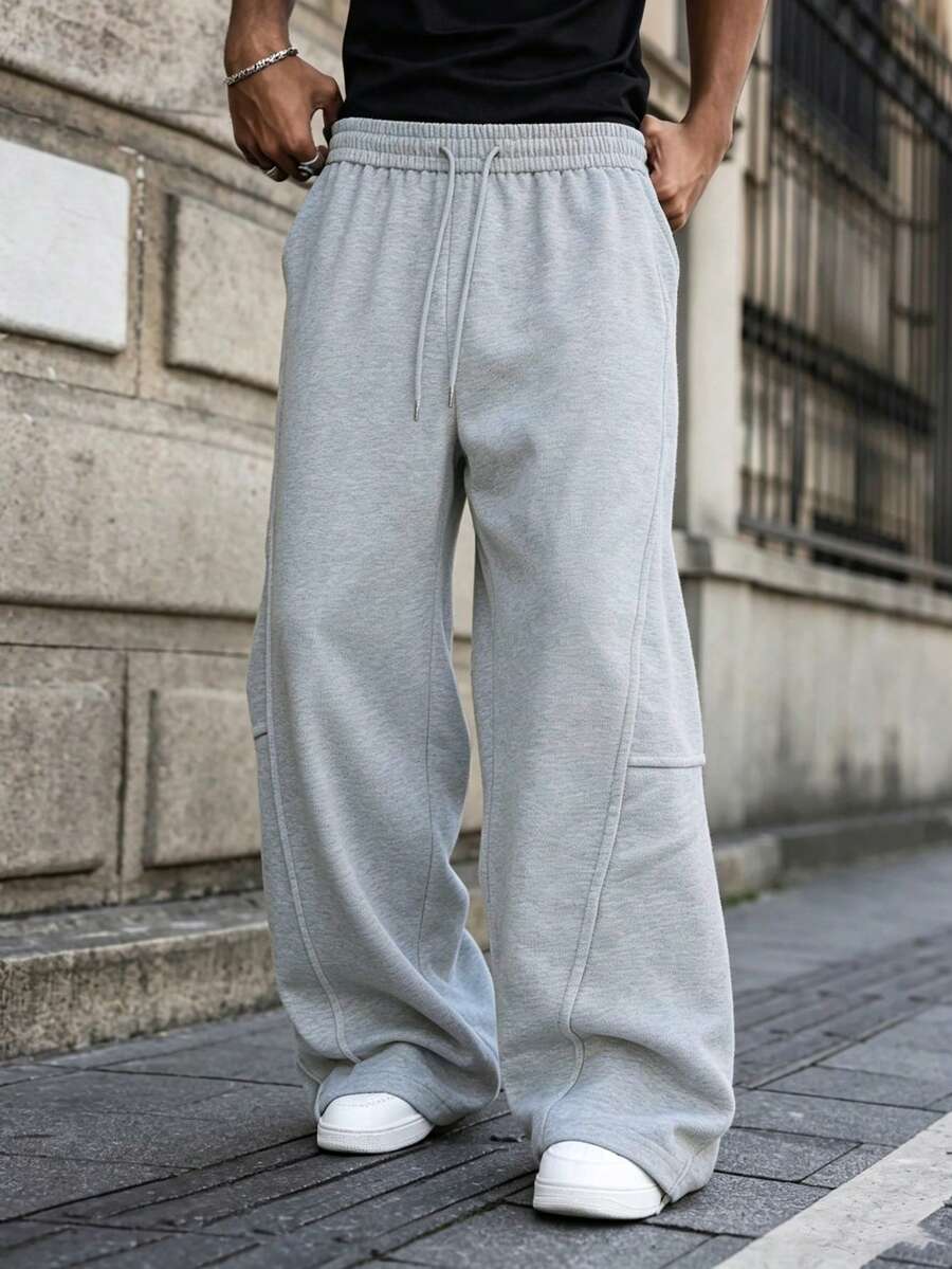 Pantalones largos deportivos para hombre, pantalones de chándal casuales minimalistas de pierna ancha, cintura elástica con diseño de cordón, finos para primavera/otoño - Gris Claro - Ver 1
