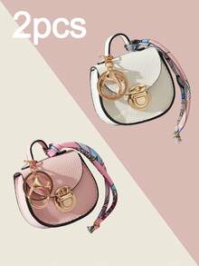 CHARM INFINITE Bolso colgante multifuncional con llavero de cierre giratorio mini en forma de silla de montar, textura de lichi en 7 colores, decoración de cinta de seda estampada, para guardar auriculares, lápiz labial y monedas - Multicolor - Ver 24