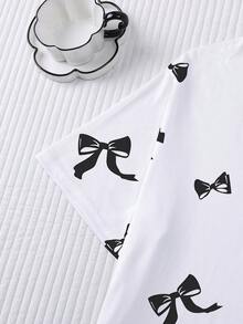 Conjunto de pijama de 2 piezas para mujer, estampado de lazos negros, ropa de estar en casa para mujer, atuendo de vacaciones de primavera/verano, top de manga corta con cuello redondo y pantalones cortos, se puede usar como ropa de exterior - Blanco - Ver 7