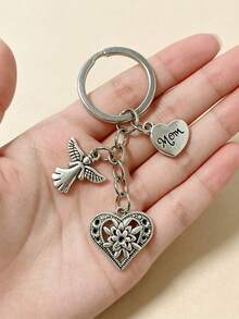 [1 pieza] Llavero vintage de plata con corazón de ángel para mamá, colgante de bolso con corazón de flor hueco, regalo del Día de la Madre para mujeres, colgante para mochila, dije de corazón de flor grabado para mamá, accesorio de bolso con tema familiar cálido, anillo de metal para llaves, soporte portátil anti-pérdida para llaves, decoración diaria para bolso, regalo conmovedor para mamá - Plateado - Ver 3