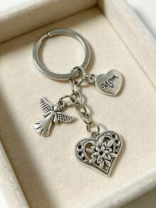 [1 pieza] Llavero vintage de plata con corazón de ángel para mamá, colgante de bolso con corazón de flor hueco, regalo del Día de la Madre para mujeres, colgante para mochila, dije de corazón de flor grabado para mamá, accesorio de bolso con tema familiar cálido, anillo de metal para llaves, soporte portátil anti-pérdida para llaves, decoración diaria para bolso, regalo conmovedor para mamá - Plateado - Ver 5