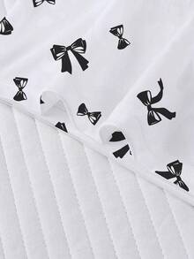 Conjunto de pijama de 2 piezas para mujer, estampado de lazos negros, ropa de estar en casa para mujer, atuendo de vacaciones de primavera/verano, top de manga corta con cuello redondo y pantalones cortos, se puede usar como ropa de exterior - Blanco - Ver 9