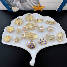 16件組金色海星貝殼硬幣鞋飾，可拆卸花園鞋與涼鞋配件，節日禮物 - 金色 - 查看 1