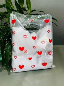 Sacola Plástica P Transparente Brilhoso Alça Vazada 25x30cm com Corações kit com 50 unidades - Visão 9