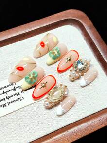 Press-On Fake Nails, Handmade Wearable Nails, Short Almond Shape, Nude With Yellow And White French Tips, Hand-Painted Gold Vine Lines, Orange-Red And Yellow Petals, Handmade 3D Embossed Green Flowers, Hand-Painted Orange-Red Outlines, Gold Starbursts, Oversized Iridescent Heart Rhinestones, Nude Oval Gemstones With Gold Trim, Gold And White Pearl Decorations, Vintage Luxury Style, Gentle And Sweet, Reusable - Multicolor - View 5