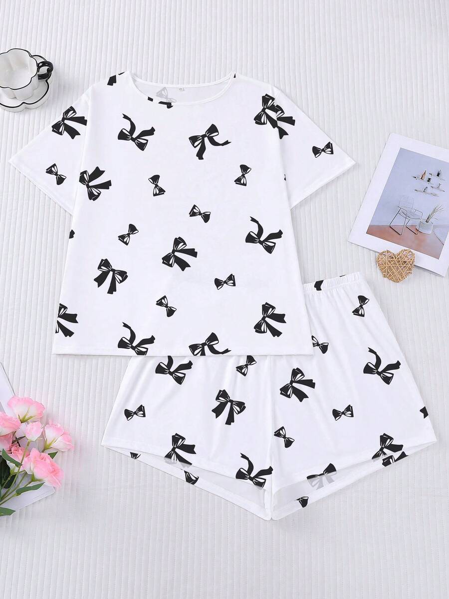 Conjunto de pijama de 2 piezas para mujer, estampado de lazos negros, ropa de estar en casa para mujer, atuendo de vacaciones de primavera/verano, top de manga corta con cuello redondo y pantalones cortos, se puede usar como ropa de exterior - Blanco - Ver 1