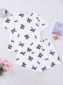 Conjunto de pijama de 2 piezas para mujer, estampado de lazos negros, ropa de estar en casa para mujer, atuendo de vacaciones de primavera/verano, top de manga corta con cuello redondo y pantalones cortos, se puede usar como ropa de exterior - Blanco - Ver 2