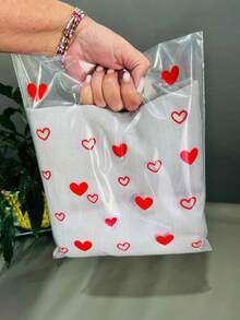 Sacola Plástica P Transparente Brilhoso Alça Vazada 25x30cm com Corações kit com 50 unidades - Visão 4