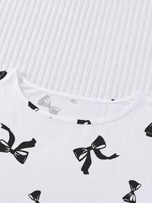 Conjunto de pijama de 2 piezas para mujer, estampado de lazos negros, ropa de estar en casa para mujer, atuendo de vacaciones de primavera/verano, top de manga corta con cuello redondo y pantalones cortos, se puede usar como ropa de exterior - Blanco - Ver 6