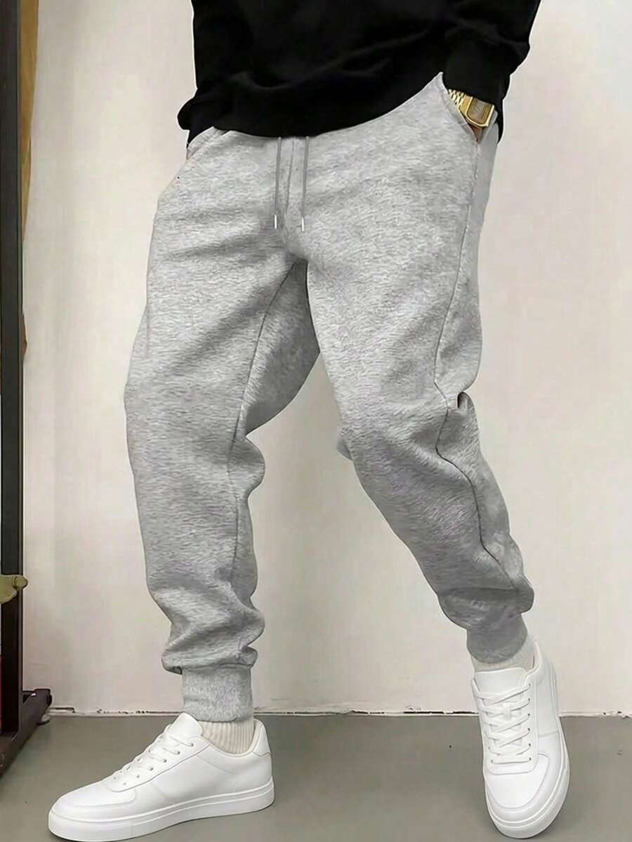 1件裝男士舒適寬鬆運動長褲－黑色運動褲，柔軟口袋，男友風設計，抽繩腰頭，適合四季穿著，休閒穿搭、放鬆與戶外活動，輕量運動褲適用於運動、跑步、健身訓練等場景，100%聚酯纖維材質