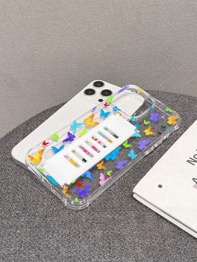 1 st transparent TPU-silikonmobilskal med fyra hörn och droppskydd, inbyggd vit ihålig silikonarmrem, UV-tryckt fjärilselement med färgglatt fjärilsmönster, moderiktigt mobilskal för iPhone 7/8/7PLUS/8PLUS/X/XS/XR/XSMAX/11/11PRO/11PROMAX/12/12PRO/12PROMAX/12MINI/13/13PRO/13PROMAX/13MINI/14/14PRO/14PROMAX/14PLUS/15/15PRO/15PROMAX/15PLUS/16PROMAX/17PROMAX