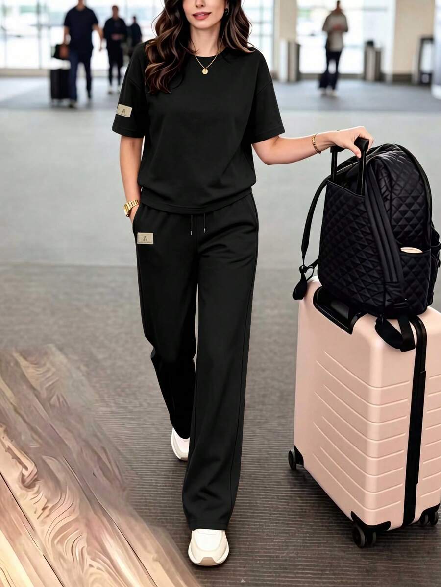 女款休閒兩件套，圓領T恤搭配微彈性長褲，舒適居家服套裝，附口袋，黑色優雅夏季款 - 黑色 - 查看 1