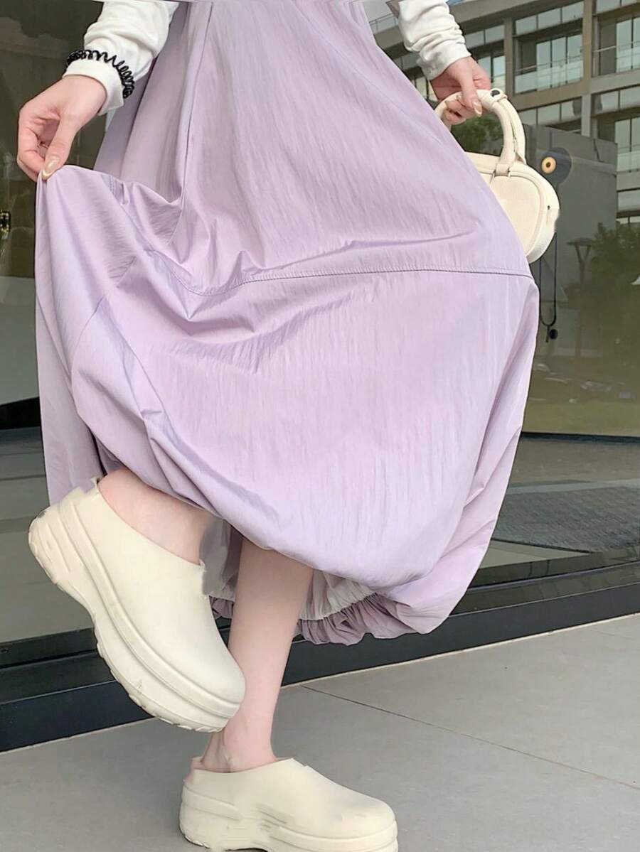 女款優雅高腰長版泡泡A字裙，附口袋，梭織布料，適合春秋穿著