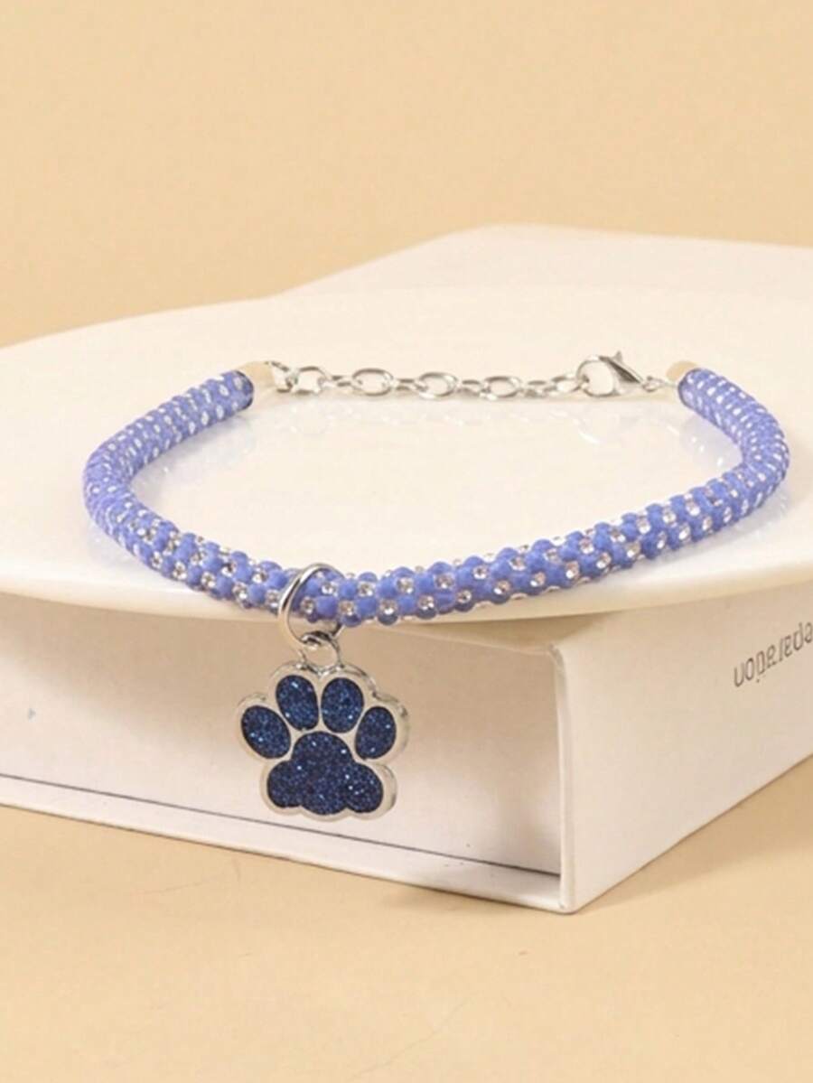 Collar con huella de pata azul y strass, adecuado para gatos y perros, cómodo para mascotas de tamaño pequeño a mediano, apto para uso durante todo el año, adecuado para uso diario en el hogar o para paseos y juegos al aire libre (Nota: El producto es frágil, no estirar en exceso) - Azul - Ver 1