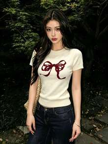 1件女款短袖針織圓領上衣，蝴蝶結圖案印花，夏季寬鬆顯瘦襯衫 - 杏色 - 查看 4