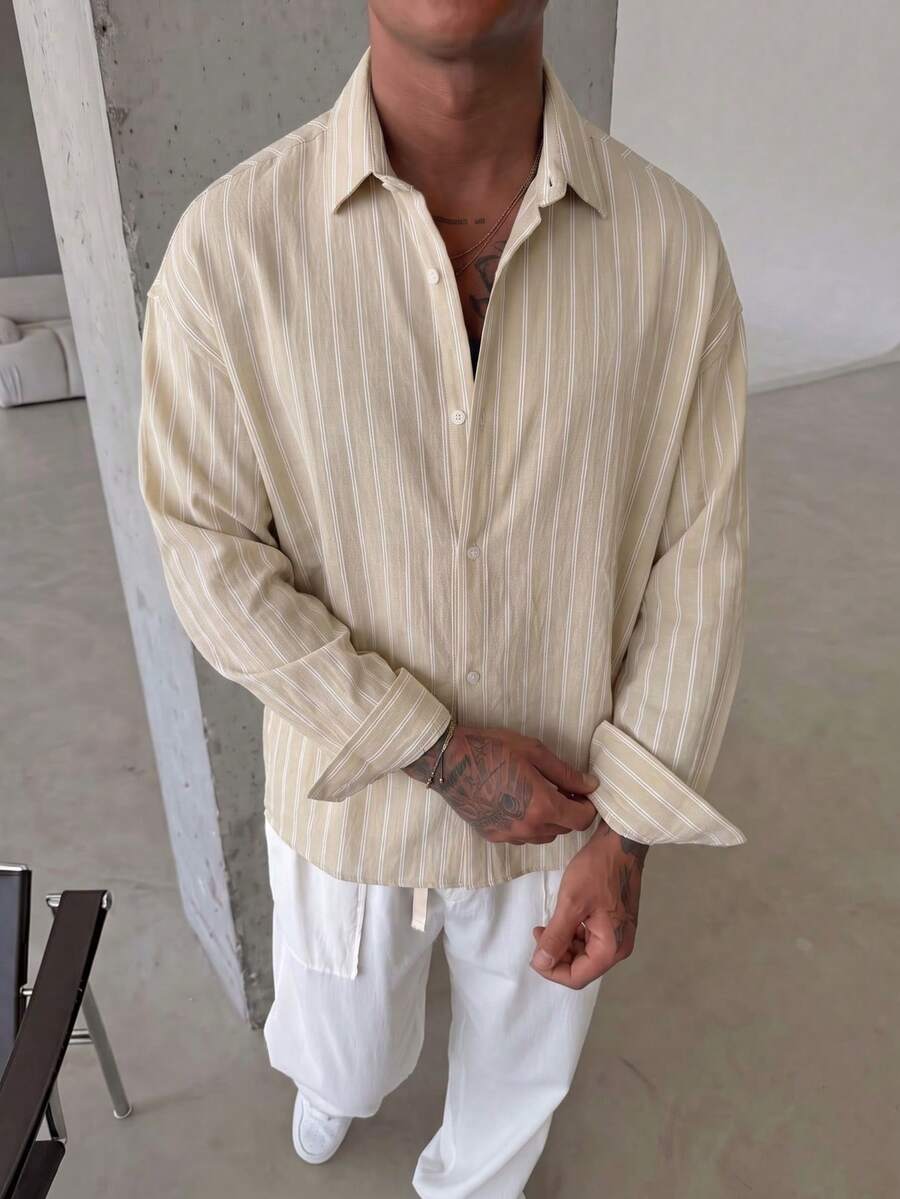 男士藍白條紋長袖休閒襯衫,慵懶簡約百搭設計,微落肩寬鬆版型,適合多季節日常穿著,舒適透氣 - 香檳色 - 查看 1