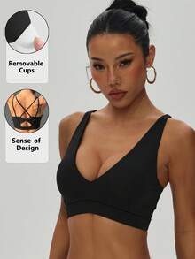 Women's Solid Color Removable Padded Criss-Cross Strap Knit Sports Bra - Black - View 1