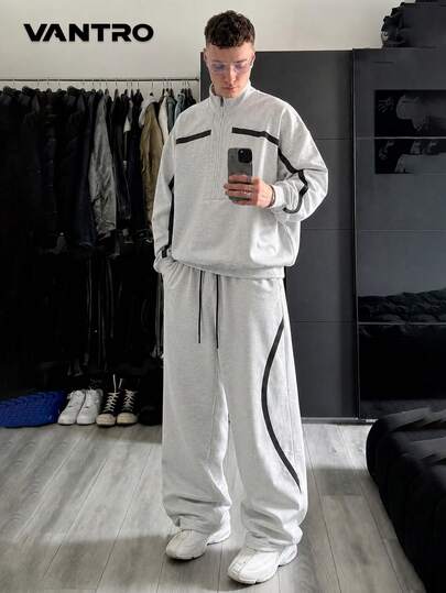 Set de 2 piese pentru bărbați cu patchwork și linii curbate negre, hanorac cu jumătate de fermoar și guler drept, cu șnur, și pantaloni largi drapați, ținută casual în stil street american