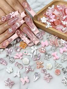 Aprox. 1100 piezas/100g de dijes mixtos para arte de uñas, estilo sexy con perlas, corazones, lazos y decoración de dibujos animados, accesorios de arte de uñas con flores, material de resina con forma de corazón de rosa, adecuado para joyería DIY, arte de uñas u otros accesorios decorativos, estilos aleatorios - aleatorio - Ver 10