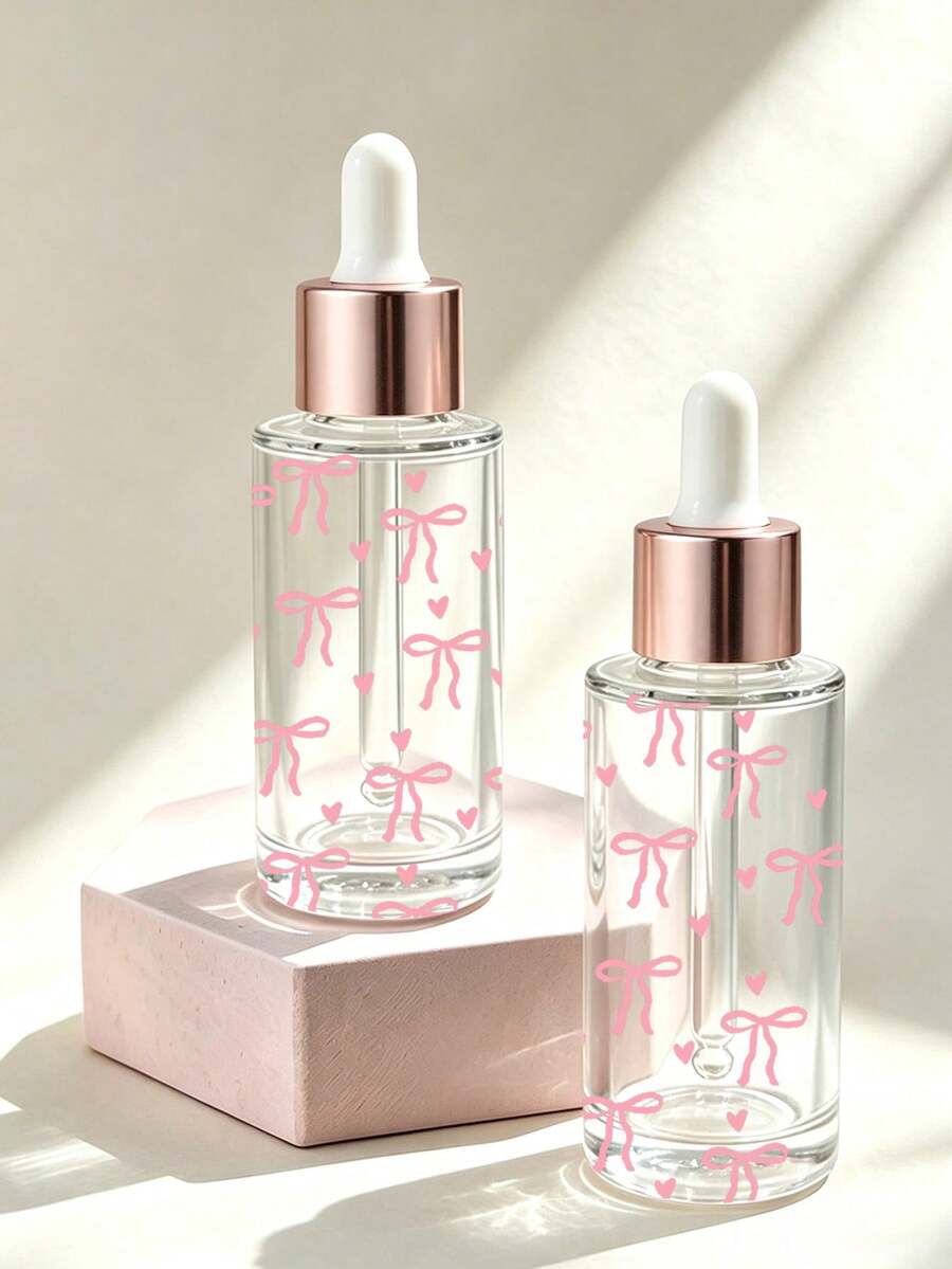 Frasco Conta-gotas de Vidro Transparente com Estampa de Laço Rosa - Frasco Dispensador de Óleo Essencial, Frasco Vazio Portátil para Viagem; Adequado para Viagem, Férias, Decoração Doméstica (Sala de Estar, Quarto, Banheiro) e Diversas Ocasiões (Casamento, Festa, Aniversário); Perfeito como Presente para Mulheres, Pais e Amigos; Combina Praticidade e Diversão. - Multicolorido - Visão 1