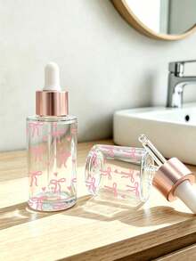 Frasco Conta-gotas de Vidro Transparente com Estampa de Laço Rosa - Frasco Dispensador de Óleo Essencial, Frasco Vazio Portátil para Viagem; Adequado para Viagem, Férias, Decoração Doméstica (Sala de Estar, Quarto, Banheiro) e Diversas Ocasiões (Casamento, Festa, Aniversário); Perfeito como Presente para Mulheres, Pais e Amigos; Combina Praticidade e Diversão. - Multicolorido - Visão 3