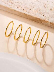 5 piezas Anillos apilables de banda fina minimalista de lujo chapados en oro de 18K de acero inoxidable, anillos de banda fina facetada 3D de acero de titanio que no se desvanecen para uso diario de niñas - Dorado - Ver 1
