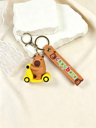 1pc Fashionable Cartoon Cute Capybara Riding Bicycle Keychain, Cute Cartoon Couple Pendant, Car Key Chain, Bag Decoration, Suitable For Casual Outings, Parties, Travel, Decoration, Wallet, Student Backpack, Graduation Gift, Holiday, Birthday, Anniversary, Small Gift For Friends, Family, Teachers, Colleagues, And For Mother, Father, Graduates And Teachers