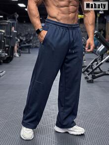 Celana Jogging Pria Mabuty Warna Navy dengan Potongan Lebar, Tali Serut, Jahitan Panel Longgar, dan Kantong Samping Dalam untuk Angkat Beban, Latihan di Gym & Olahraga. - Navy Blue - View 1