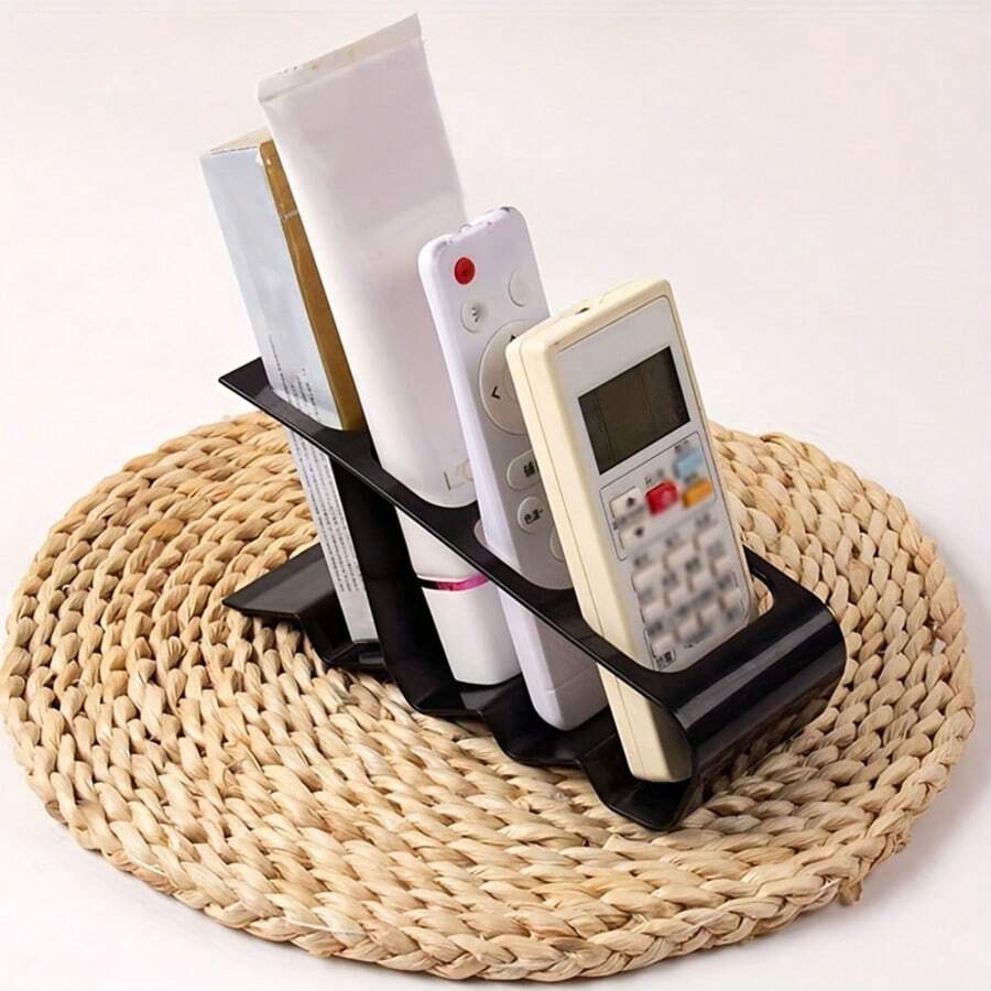 1pc 4-Slot Remote Control Holder, Durable Plastic Minimalist Black Desktop Organizer, Ergonomic Design, Can Store 4 Remote Controls, Space-Saving Home Office TV Storage Rack, Multi-Functional Storage Shelf, Practical Minimalist Design