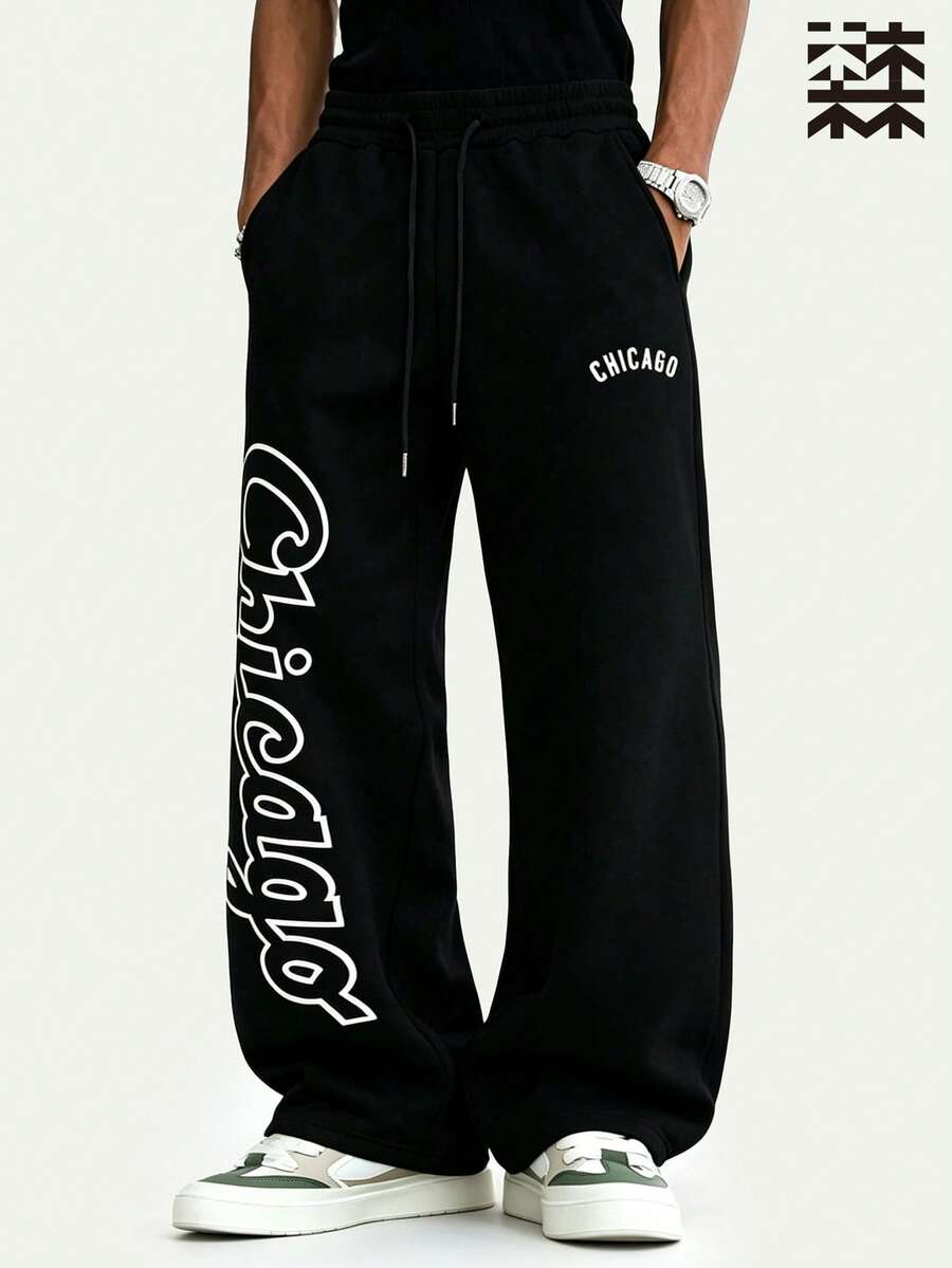 mulinsen Men's Elastic Waist Loose Straight Leg Wide Leg Pants, Black Base With Letter Print Heat Transfer Hip-Hop Style - Black - View 1
