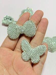 1 pieza Blanco Lujo Brillo Completo de Strass Símbolo de Dólar Bolsa de Dinero Lazo de Labios Oso Mariposa Adorno de Encanto de Diseñador Funda de Teléfono Decoraciones de Coche DIY Sin Adhesión Espejo Retrovisor Accesorios de Salida de Aire del Coche Manualidades - blanco - Ver 5