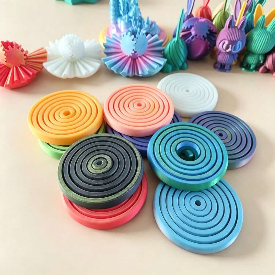 1個 7環魔力轉盤紓壓指環玩具，3D精巧輪身搭配色塊設計，旋轉順滑不卡頓，觸感柔軟細膩，耐磨耐變形的耐用材質，緩解焦慮與不安，輕巧便攜適合居家與旅行，優雅風格適合辦公室裝飾，情人節、聖誕節與生日的高吸引力紓壓禮物