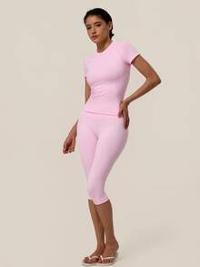 TimeOff Conjunto deportivo de mujer de un solo color sin costuras con cuello redondo, manga corta, cintura acanalada y pantalones de largo medio - Rosa - Ver 9