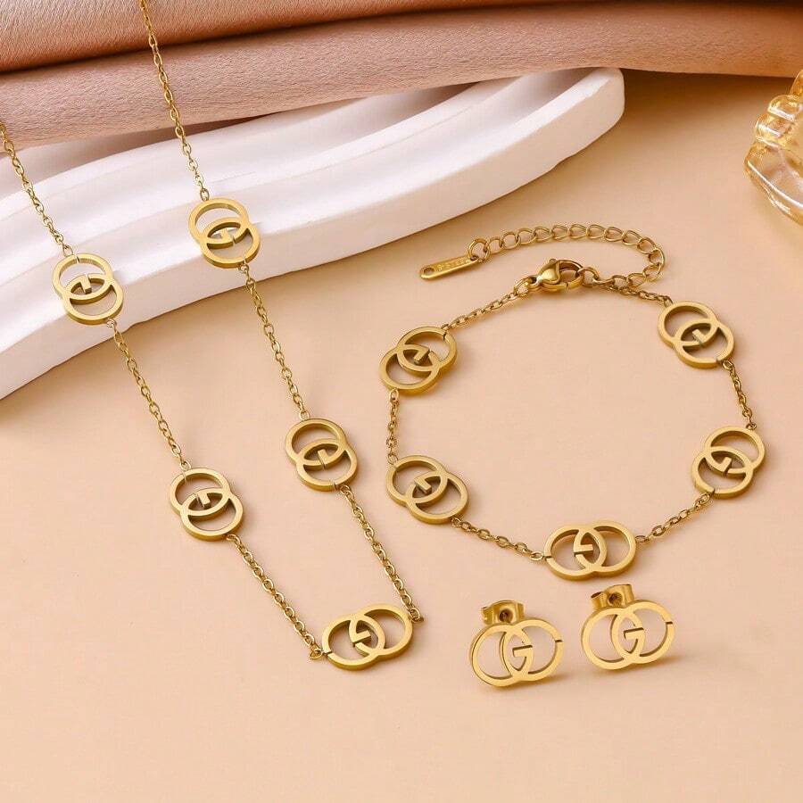 Conjunto de Pulseira, Colar e Brincos de Aço Inoxidável com Letra CG Vazada Geométrica - Dourado - Visão 1