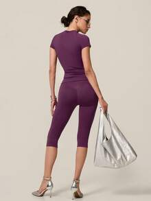 TimeOff Conjunto de mujer de un solo color sin costuras con cuello redondo, manga corta, cintura acanalada y pantalones de largo medio para gimnasio, correr y entrenamiento - Morado - Ver 10