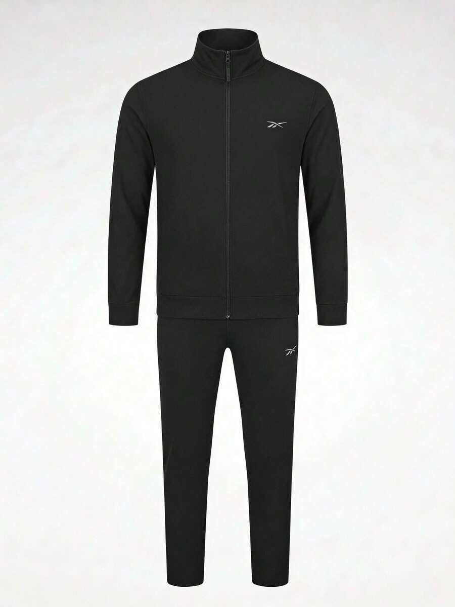 Conjunto Reebok Tracksuit Vector para Hombre Chamarra Cierre Completo y Pantalón Deportivo de Ajuste Regular Tejido Suave Logotipo Vector Minimalista Calentamientos Entrenamiento y Casual - Negro - Ver 1