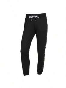 Under Armour Setelan Olahraga Tricot Wanita dengan Motif Samping dan Kerah Tegak, 1365147-005 - Hitam - View 9