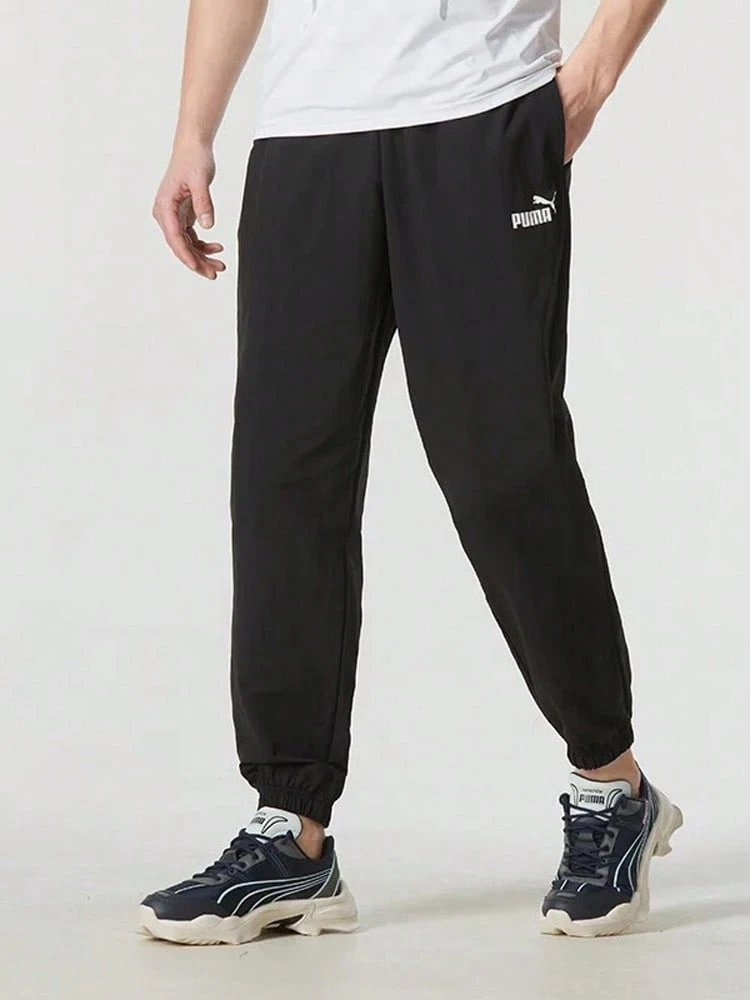 PUMA Solid Color Casual Woven Drawstring Mid-Rise Knit Joggers Unisex Black - Black - View 1