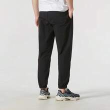PUMA Solid Color Casual Woven Drawstring Mid-Rise Knit Joggers Unisex Black - Black - View 4