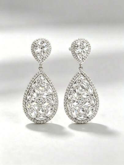 Lightly Luxurious Drop-Shaped Earrings Set With Gemstones. This Elegant Dress Is Paired With Delicate Earrings That Make The Face Appear Smaller
