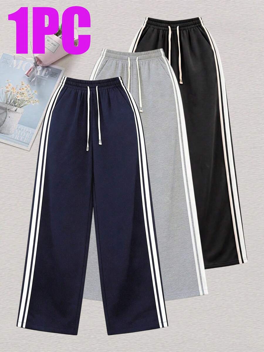 Celana panjang bergaris ini cocok untuk semua musim, sempurna untuk aktivitas luar ruangan dan pakaian kasual, serta mudah dipadukan dengan berbagai atasan. - Navy Blue - View 1
